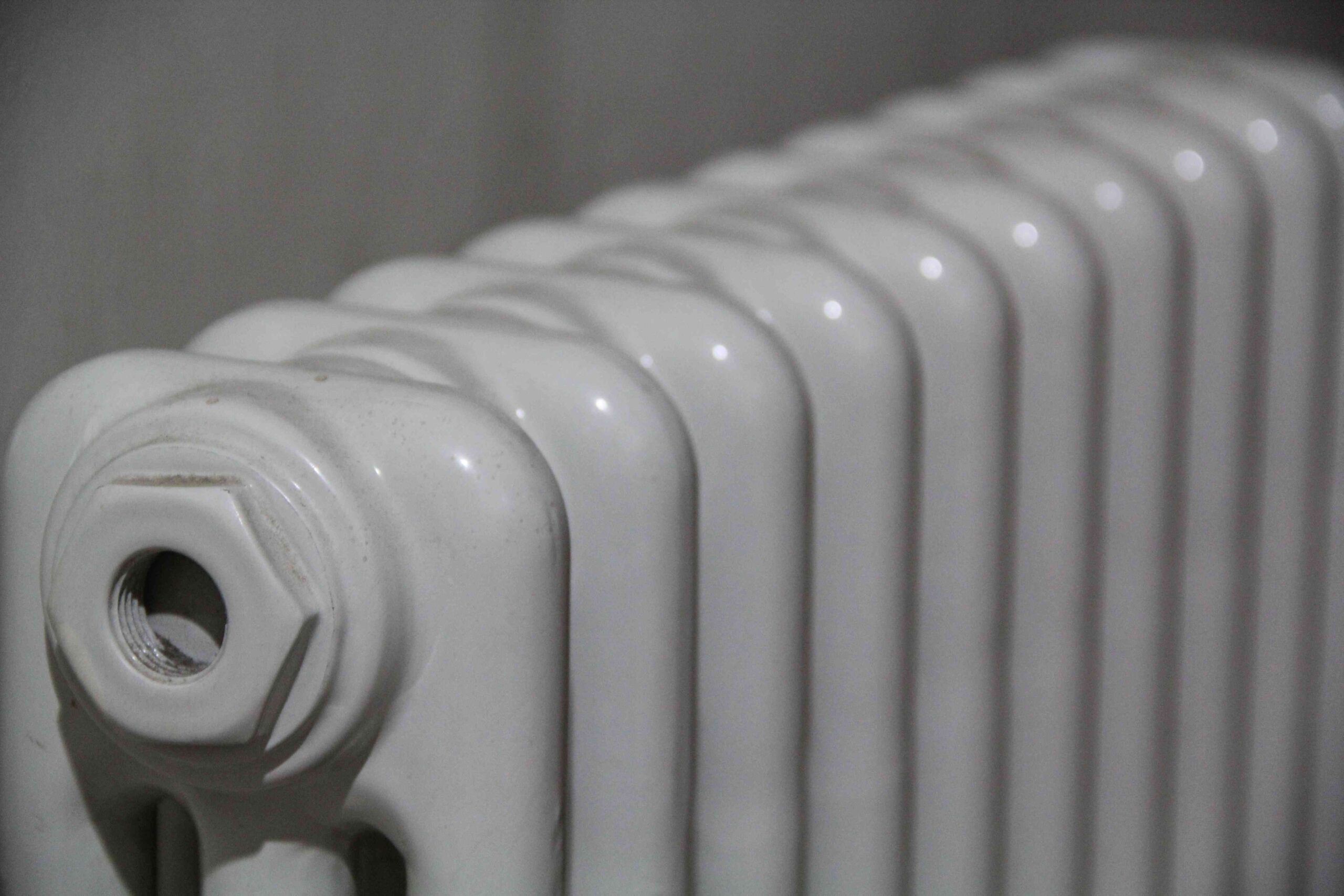 Closeup shot of white radiator , broken radiator repair