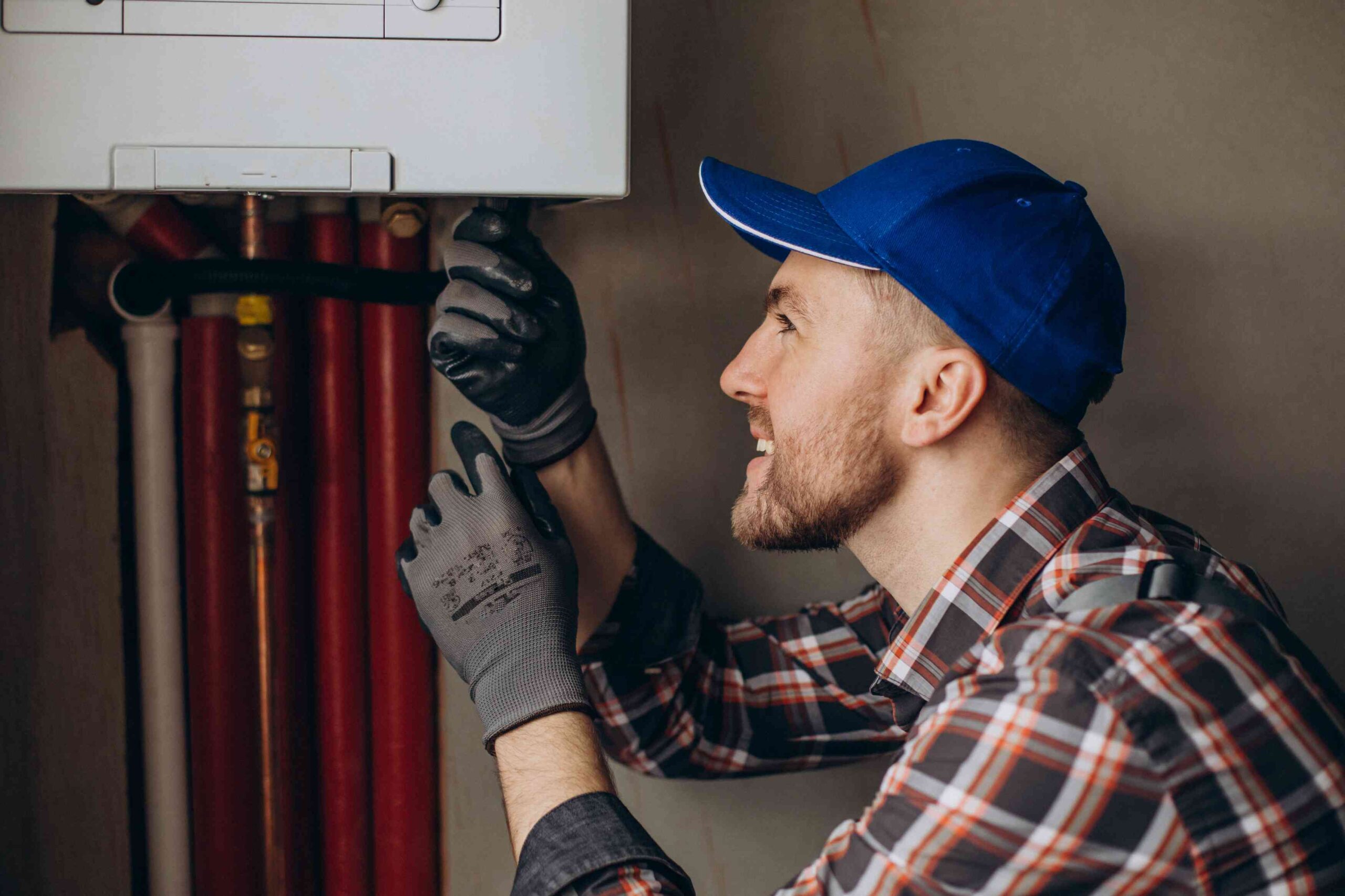 gas engineer fixing boiler, Heating Maintenance